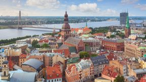 View over central Riga, Latvia, with Riga Cathedral and Daugava River in the background.
